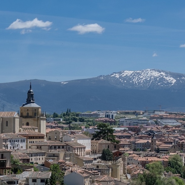 Photo of the rooftops of Madrid, Spain with the Sierra de Guadarrama mountains in the distance